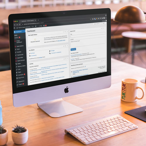 A Wordpress website dashboard displayed on a Mac computer