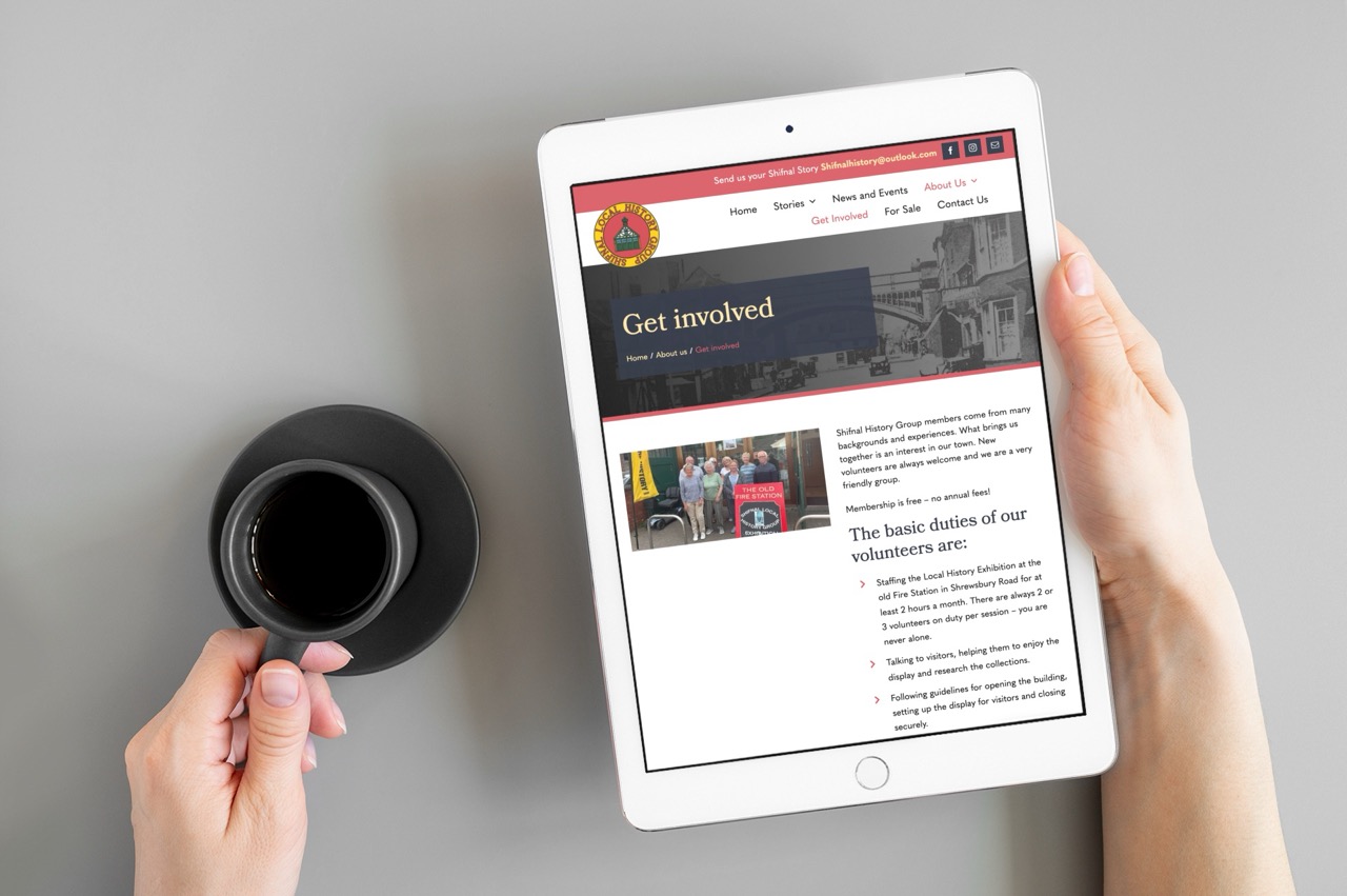 Shifnal Local History Group website. Hand holding a tablet displaying the Get Involved page for the Shifnal Local History Group website.